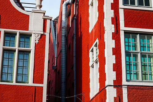 window red and white painted concrete building belgium